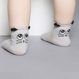 Grey cat with face on back