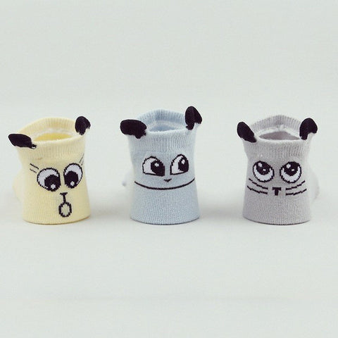 Delightful baby socks with faces on the back
